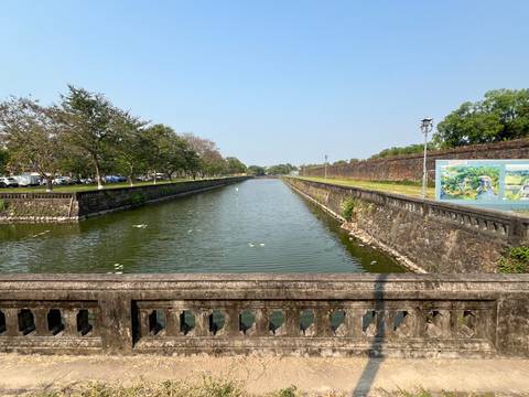 Long rectangular moat lined with stone walls inside the Hue Citadel.