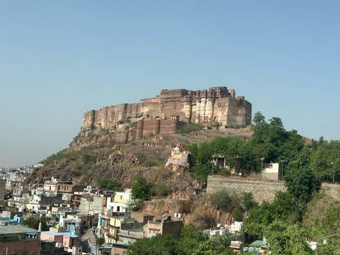 Mehrangarh Fort rises above the rocky hilltop overlooking the white-washed houses of Jodhpur.