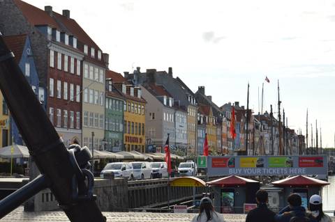 Iconic colourful townhouses and moored boats line Copenhagen’s Nyhavn waterfront