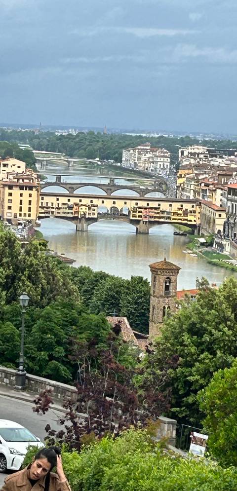 Artistic filtered image of Ponte Vecchio bridge spanning the Arno River in Florence.
