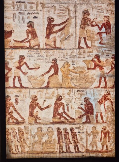 Ancient tomb painting depicting workers mixing and carrying grain, with faded red and ochre tones.
