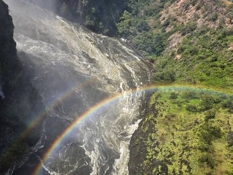 Double rainbow arcs above the turbulent Zambezi River gorge near Victoria Falls.