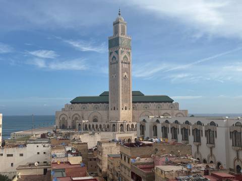 Rooftop view of the Hassan II Mosque complex bordering the Atlantic Ocean in Casablanca.