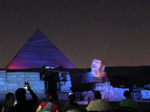Sound-and-light show projects a pharaoh’s face onto the Sphinx with coloured lights on a pyramid.