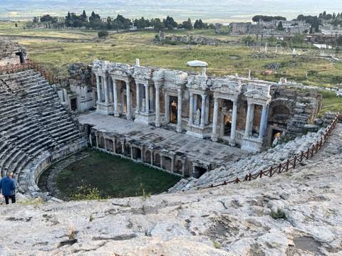 Well-preserved ancient Roman theatre at Hierapolis with tiered seating and ornate stage