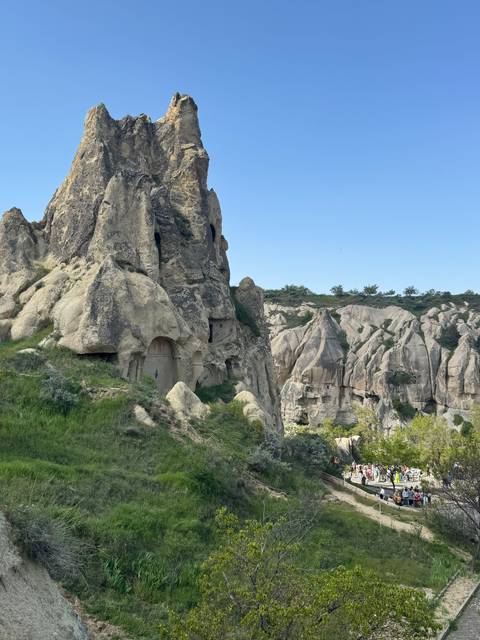 Rocky fairy-chimney formations with ancient cave dwellings in Cappadocia