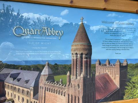 Informational sign board about Quarr Abbey on the Isle of Wight with photo illustration.