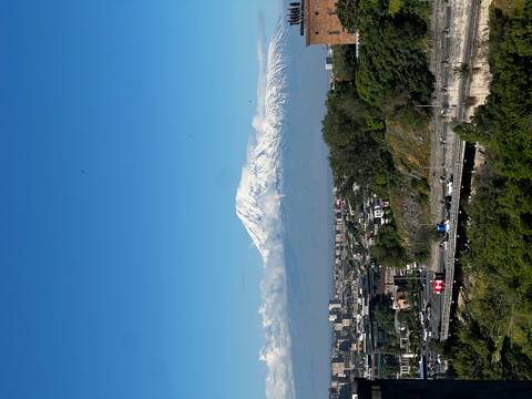 Snow-capped Mount Ararat rises above the cityscape of Yerevan on a crystal clear day.