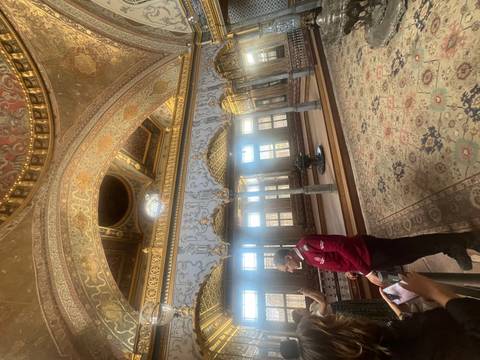 Lavish gilded hall inside Topkapi Palace showcases intricate Ottoman architecture.