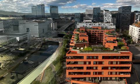 Aerial view over Oslo’s modern Barcode district with a mix of glass and brick high-rises.