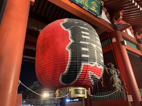 Close-up of the giant red paper lantern hanging at Tokyo’s Kaminarimon gate by night