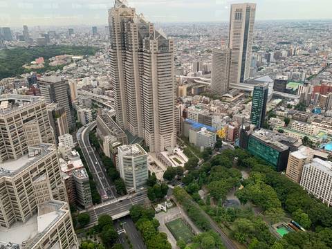 Panoramic aerial view of Tokyo’s skyscrapers and green parks from a high observation deck