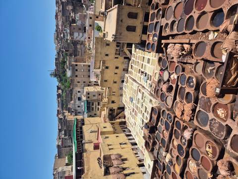 View over the honey-colored vats of the famous leather tanneries in Fes’ old medina.