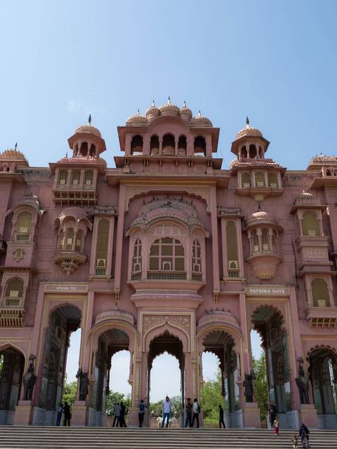 Close-up view of the ornate pink Patrika Gate with its intricate arches and lattice windows in Jaipur.
