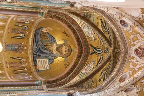 Golden mosaic of Christ Pantocrator and angels in cathedral apse