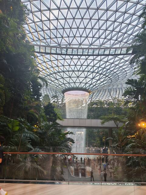 Spectacular indoor waterfall inside the glass-domed Jewel Changi Airport