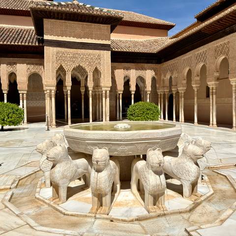 Iconic Lion Fountain centred in the marble courtyard of the Alhambra.