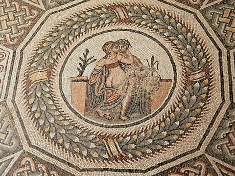 Detailed ancient Roman mosaic of an embracing couple, Sicily.