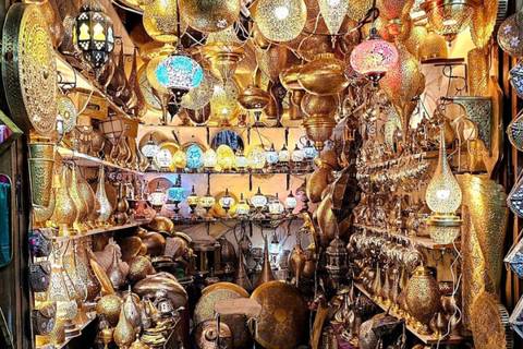 Densely packed lantern and metalwork shop glowing with golden lights