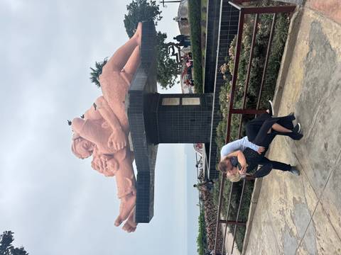 Romantic dip under the iconic El Beso sculpture in Miraflores Love Park overlooking Pacific Ocean