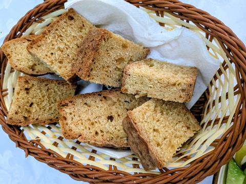 Basket filled with slices of homemade crusty bread lined with a napkin