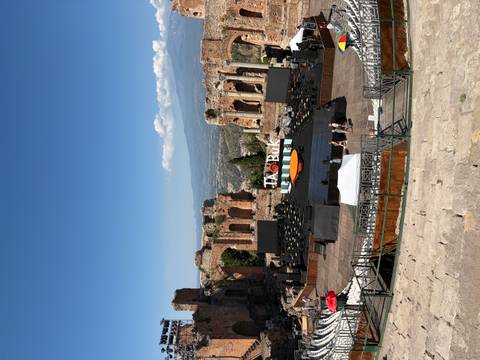 Ancient Greek Theatre of Taormina with stage set and Mount Etna in background