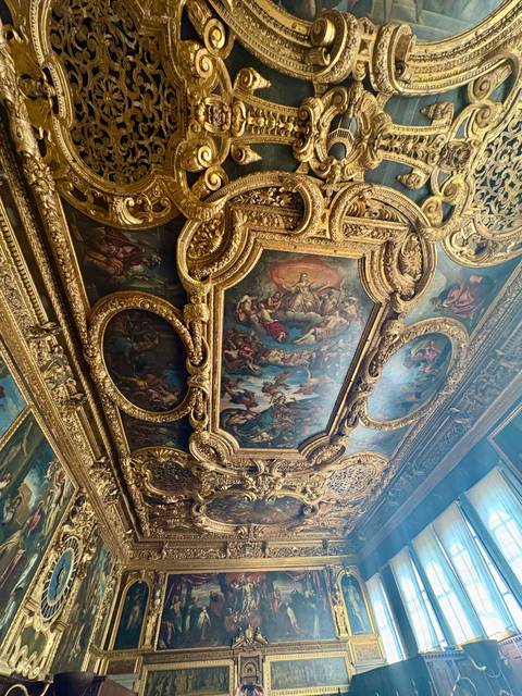 Ornate gilded Renaissance ceiling painting inside Venice's Doge's Palace.