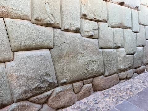 Detail of perfectly fitted twelve-angled Inca stones forming an ancient Cusco wall.