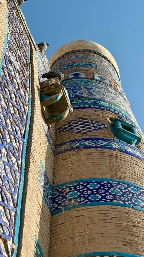 Close-up of intricate blue tile work on a historic Pakistani shrine.