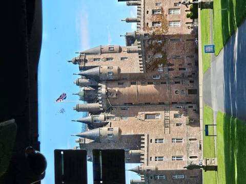 Closer view of Glamis Castle taken from inside a vehicle with some window glare