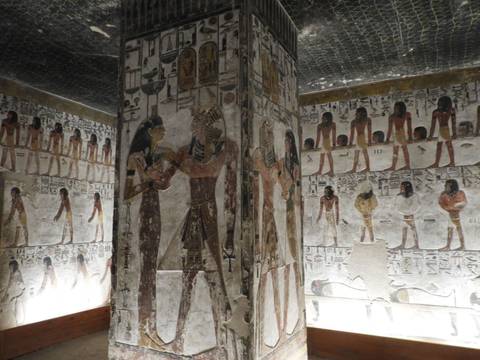 Colorful hieroglyphic murals covering walls inside a pharaoh's tomb in the Valley of the Kings