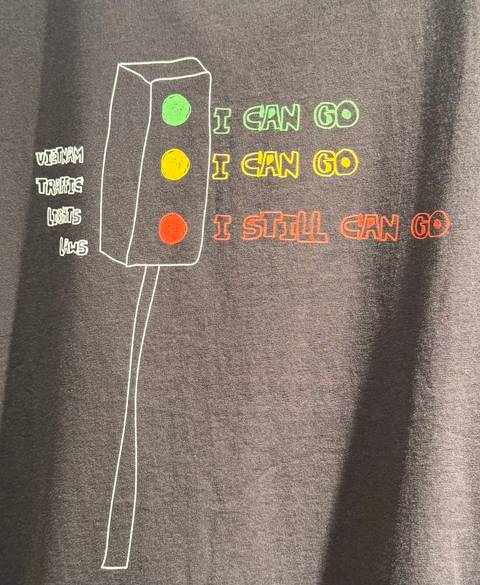 Close-up of a novelty T-shirt with humorous traffic light text.