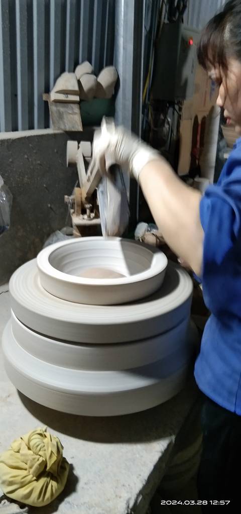 Blurry close-up of a pottery wheel in motion during a ceramics workshop.