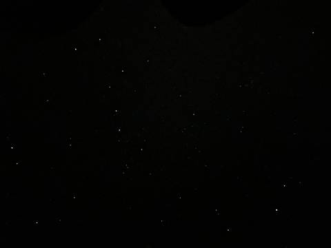 Black sky filled with scattered bright stars captured on a clear desert night