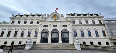 Grand baroque façade of Vienna’s Upper Belvedere Palace crowned by an Austrian flag.