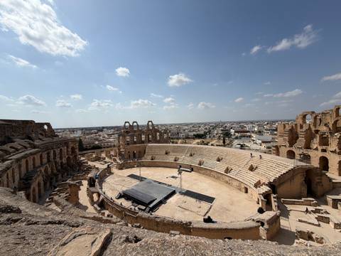 Sweeping view of El Jem’s ancient Roman amphitheatre with the modern town stretching out beyond.