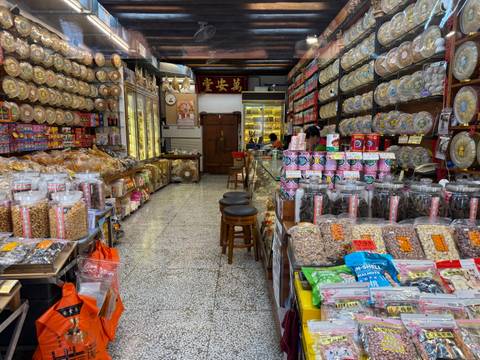 Interior of traditional shop filled with jars and packages of goods on shelves