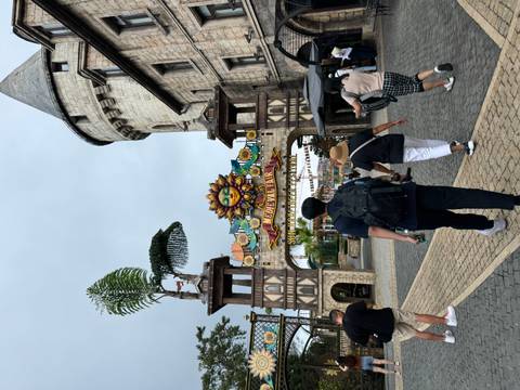 Entrance archway labeled 'Medieval Fair' at Sun World Ba Na Hills with visitors walking in.