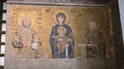 A detailed Byzantine mosaic depicting religious figures in rich gold and colored tesserae.