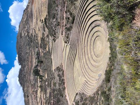 Concentric agricultural terraces of the ancient Moray site spiral into the Peruvian highlands.