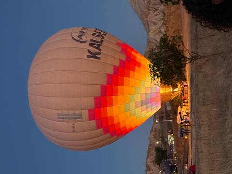 Colourful hot air balloon being inflated at dawn in Cappadocia
