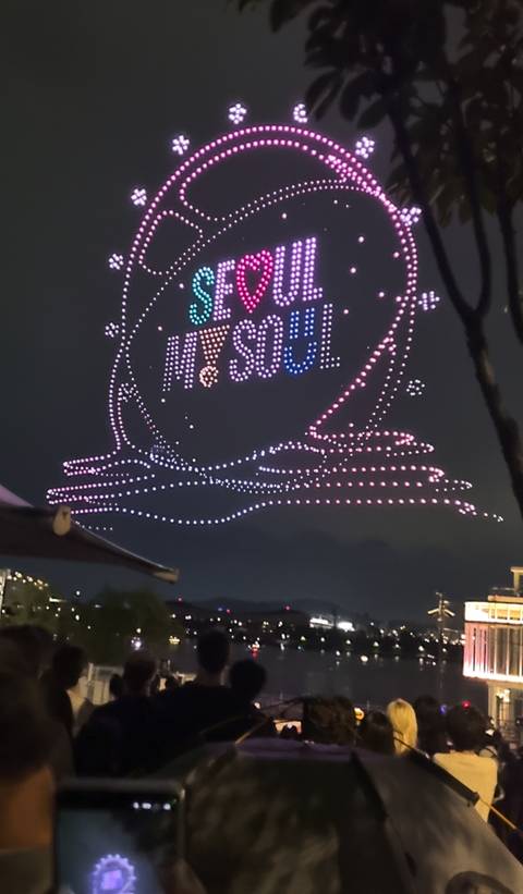 Nighttime drone light show spelling out ‘SEOUL’ in colorful formations