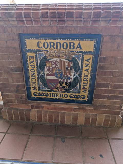 Colorful ceramic tile panel showing the coat of arms for the 1929 Ibero-American Exposition.