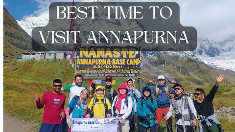 Group of trekkers posing at Annapurna Base Camp sign overlaid with large promotional text.