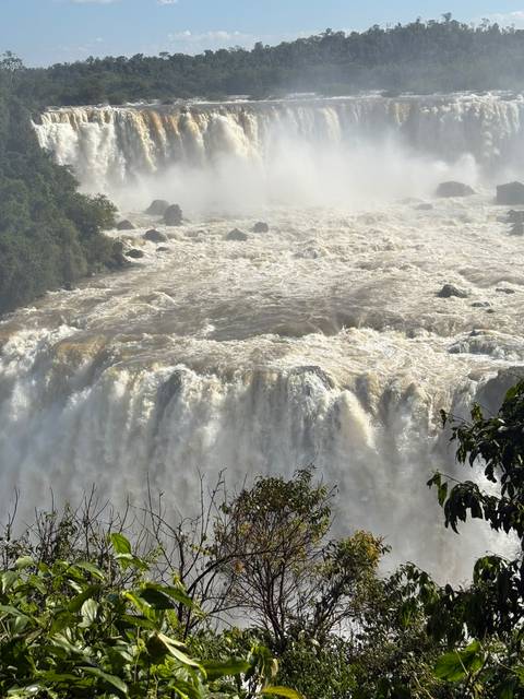 Close view of turbulent brown waters plunging over Iguazu Falls.