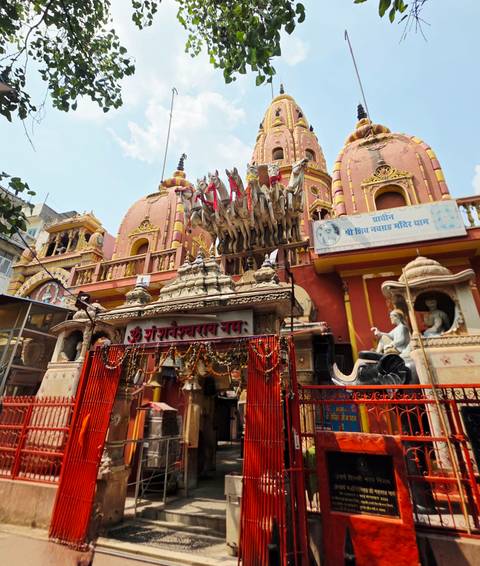 Colourful Hindu temple facade featuring a chariot sculpture of Krishna and Arjuna