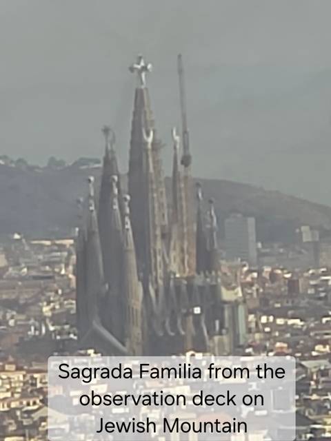 Very soft, zoomed-in view of the spires of La Sagrada Família against a hazy city background