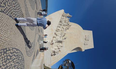 Padrão dos Descobrimentos monument with detailed stone carvings of explorers, visitors taking photos below