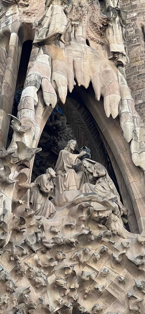 Stone sculptural group on the Nativity façade of the Sagrada Familia.