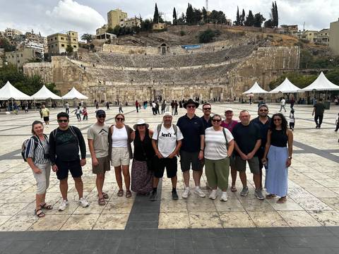 Tour group standing in front of the ancient Roman Amphitheatre in the heart of Amman.